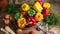 Red, green and yellow sweet bell peppers on table,