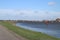 Red guiding post in the river Hollandsche IJssel to mark the safe waterway in the water.