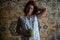 Red Hair Caucasian Girl in Chintz nightgown Sleepwear holding Little Watermelon with the Soviet Carpet on Background