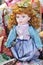 Red hair doll to be sold at souvenir market in Romania. Gift doll. Romanian traditional colorful handmade doll