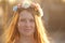 Red hair Girl Portrait in circlet of flowers
