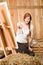 Red-hair romantic woman in barn painting country