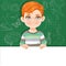 Red haired boy holds large white horizontal banner on a green background