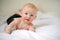 Red-haired boy smiling and crawling