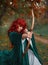 Red-haired fiery robber in moment before attack, the legend of Robin Hood, girl is holding a bow and arrow in her hands
