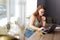 Red-haired freelance writer sitting in cafe while working hard