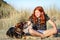 Red haired girl with pet dog