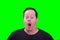 Red haired middle aged male surprised amusing facial expression on bright green screen background