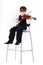 Red-haired preschooler boy with violin