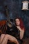 Red haired woman with acoustic guitar