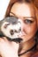 Red haired woman and cute ferret