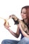 Red haired woman feeding ferret a banana