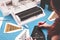 red-haired woman with painted nails sits at plotting workplace to complete christmas graphic from black adhesive vinyl foil.