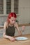 Red-haired woman suffering from anorexia eating nothing