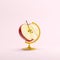 Red Half Apple global idea concept on pink color pastel background.