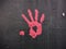 Red Hand Print On A Wall