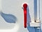 Red handle on white metalic door