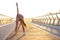 Red head young woman with long hair warming before workout