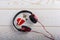 Red headphones, key and music written red heart  on wooden background