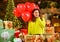 Red heart air balloon. Xmas spirit. Happy girl christmas tree. Holiday celebration. Celebrate holiday. Holiday tradition