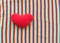 Red heart on a background of rainbow fabric. place for text. bright banner, concept. love. copy space