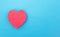 Red heart on a blue background. Concept of human heart disease and heart bypass surgery. Myocardial infarction and angina pectoris