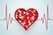 Red Heart Box with Pills on a Cardiogram Background. 3d Rendering