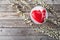 Red heart cacke desserts and sakura on wooden background. dessert for breakfast on Valentine`s Day