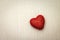 Red heart on cardboard background. Valentine wallpaper.