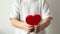 Red heart close up in hands of little kid boy on Valentines Day