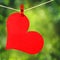 Red Heart with Clothespin Hanging on Clothesline over Green