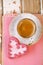 Red heart cookies and espresso Coffee cup on old wooden table