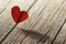 Red Heart dried leaf on wooden backdrop. Happy valentines day