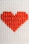 red heart embroidered with cross stitch