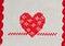 Red heart embroidered in cross stitch