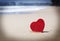 Red heart on exotic sandy beach