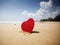 Red heart on exotic sandy beach