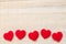 Red heart fabric on vintage fabric background.