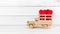 Red Heart Fabric on Wooden Toy Truck over white background. Love Concept with Copy Space
