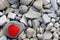 Red heart on a figured stone. many gray stones