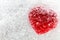 Red heart frozen in ice Valentine`s Day