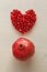 Red Heart of Grenades. Big Ripe Red Granets or Garnets. Fruits of Red Ripe Pomegranate on the White Background. Vegetarian Concept
