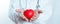 Red heart in hand doctor women. cardiology symbol. treatment and healthcare concept