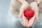 Red heart in hands from above. Healthy, love, donation organ, do