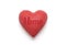 Red heart with imprinted home word over white background