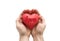Red heart with imprinted love word in man`s hands.