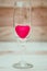 Red heart inside wine glass