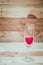 Red heart inside wine glass