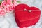 Red heart jewel gift box with pink carnation