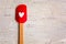 Red with heart kitchen spatula on wooden background